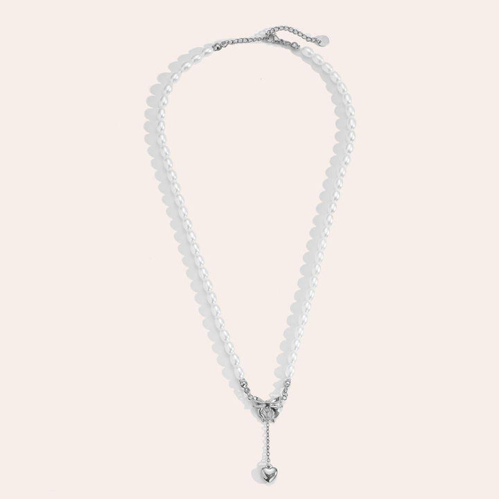 "Norariaine" Bowtie With Heart In Pearl Chain Stainless Steel Necklace